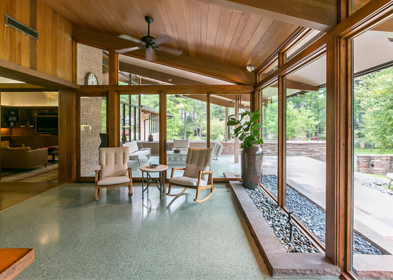 Mid Century enclosed porch with large Marvin Windows and Doors