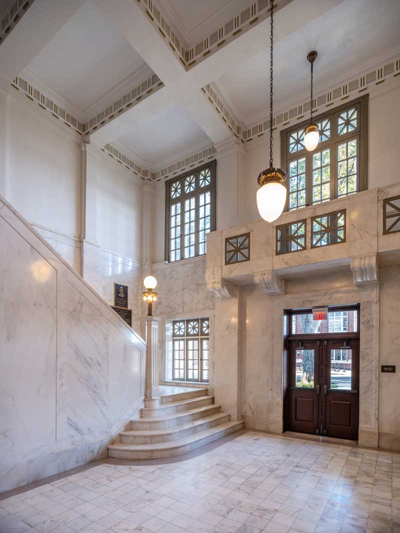 A marble staircase below Marvin windows inside the Mississippi County Courthouse.