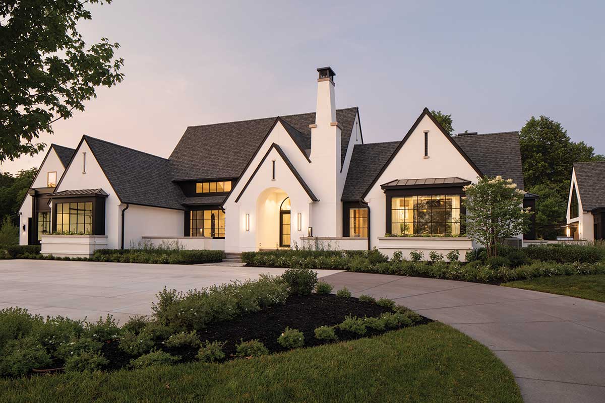 The front exterior of a modern European home, featuring Marvin windows and doors.