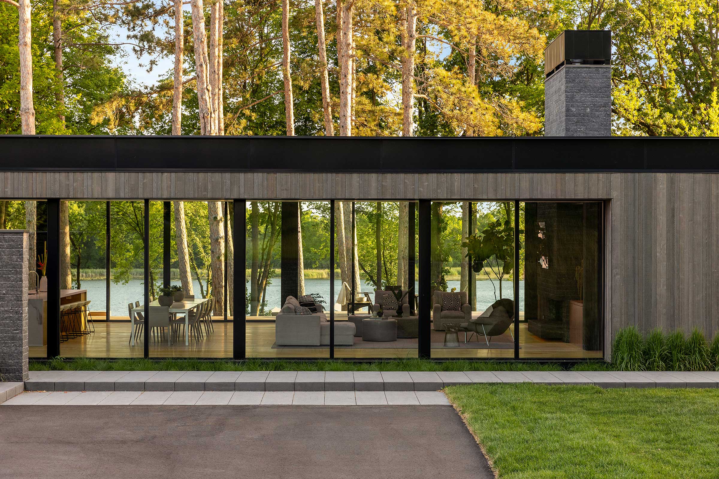 A modern home on Lake Minnetonka, featuring Marvin Modern Multi-Slide doors and Marvin Modern windows.