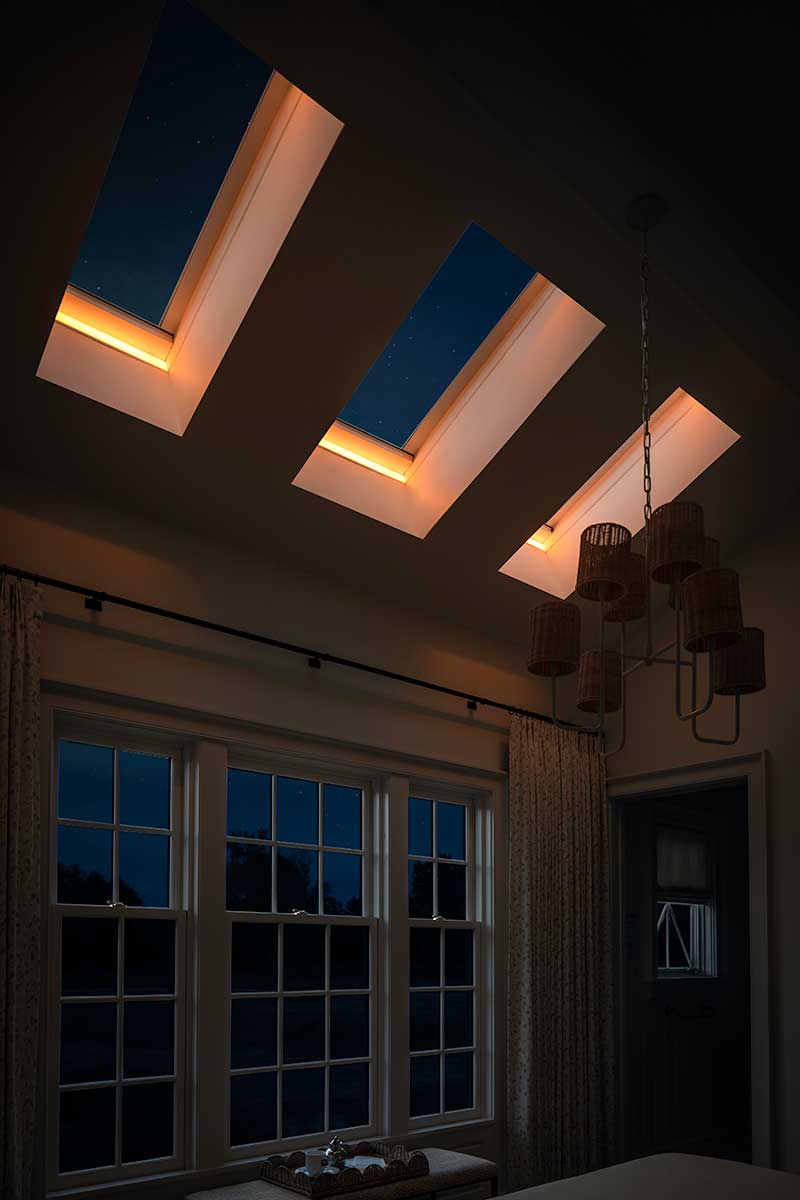 Three Marvin Awaken Skylights with tunable lighting at night in the Southern Living Idea House in Kentucky.