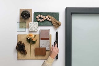 A flat lay with décor items displaying Marvin Gunmetal.