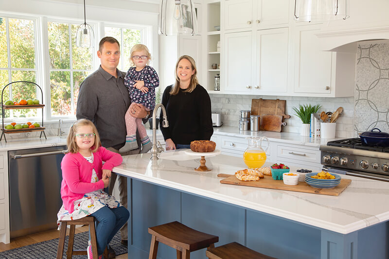 Shayla and Scott Adams Family in their kitchen with Marvin Windows