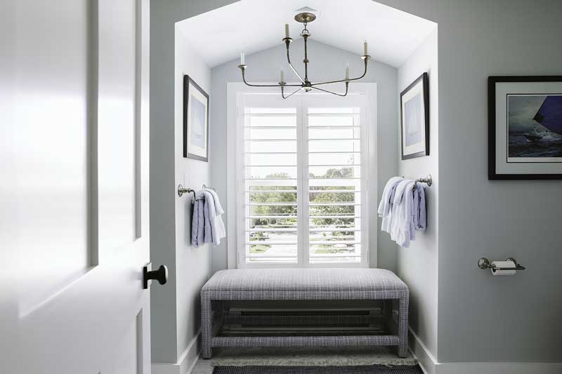 A bathroom in a condo at The Standard with seating area filled with light from a Marvin Ultimate Double Hung G2 window.