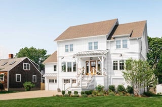 The exterior of a white home with Marvin windows and doors