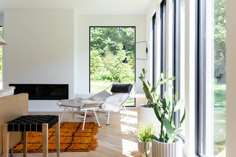 Modern farmhouse living room in Kalamazoo, Michigan, featuring Marvin Elevate Direct Glaze windows.