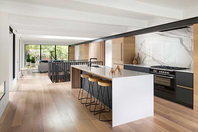The minimalist kitchen of a modern home in Golden Valley, Minnesota features Marvin Modern windows.