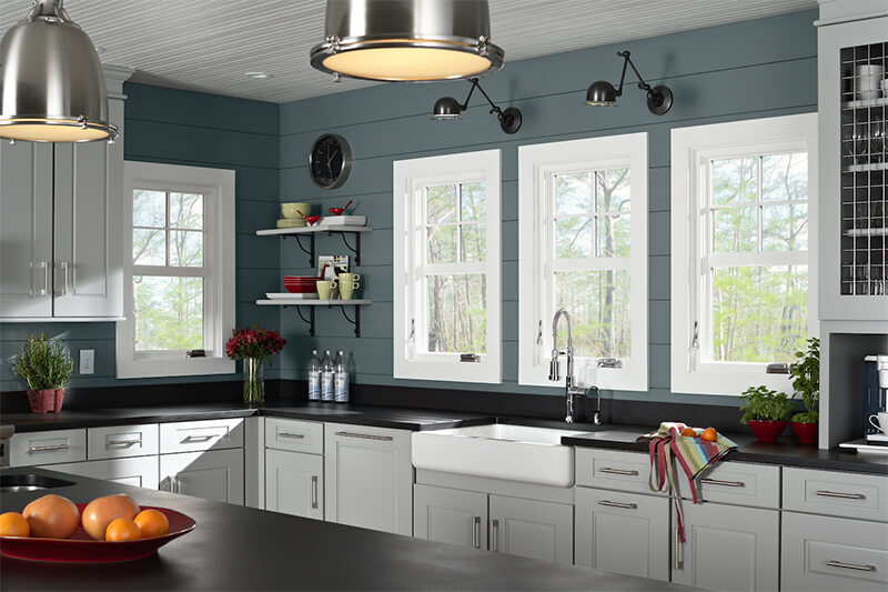 A kitchen with four casement windows.
