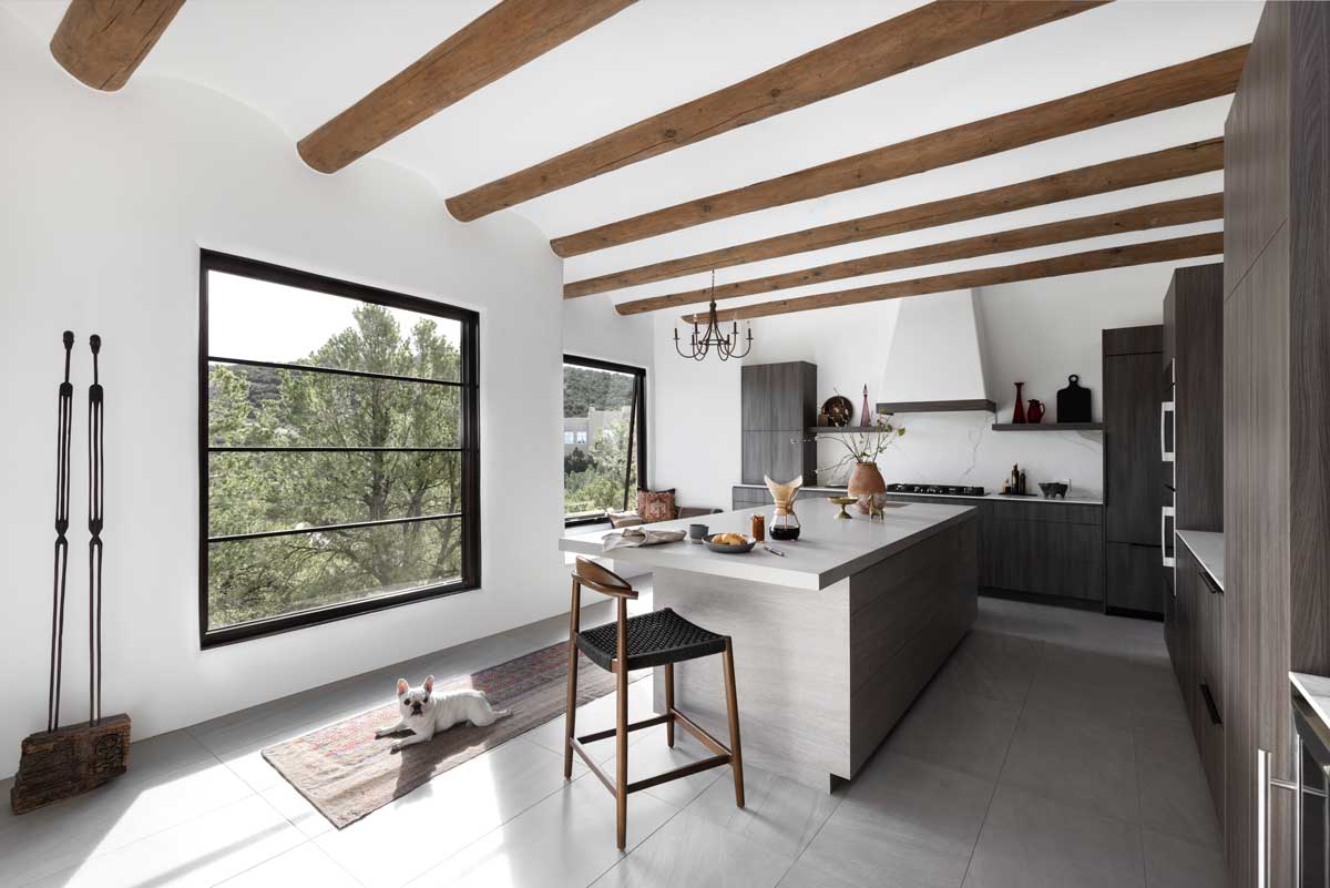 An Adobe-style kitchen at a home in Santa Fe, New Mexico, featuring Marvin Ultimate windows.