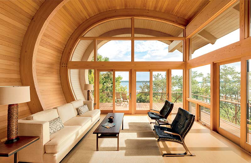 Geometric custom shaped windows from inside a sitting room.