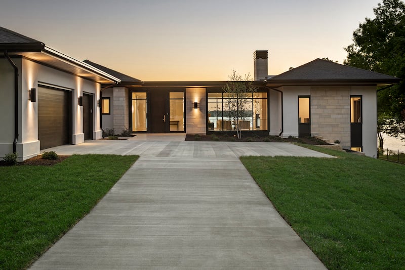 Driveway leading up to a home featuring Marvin Modern windows.