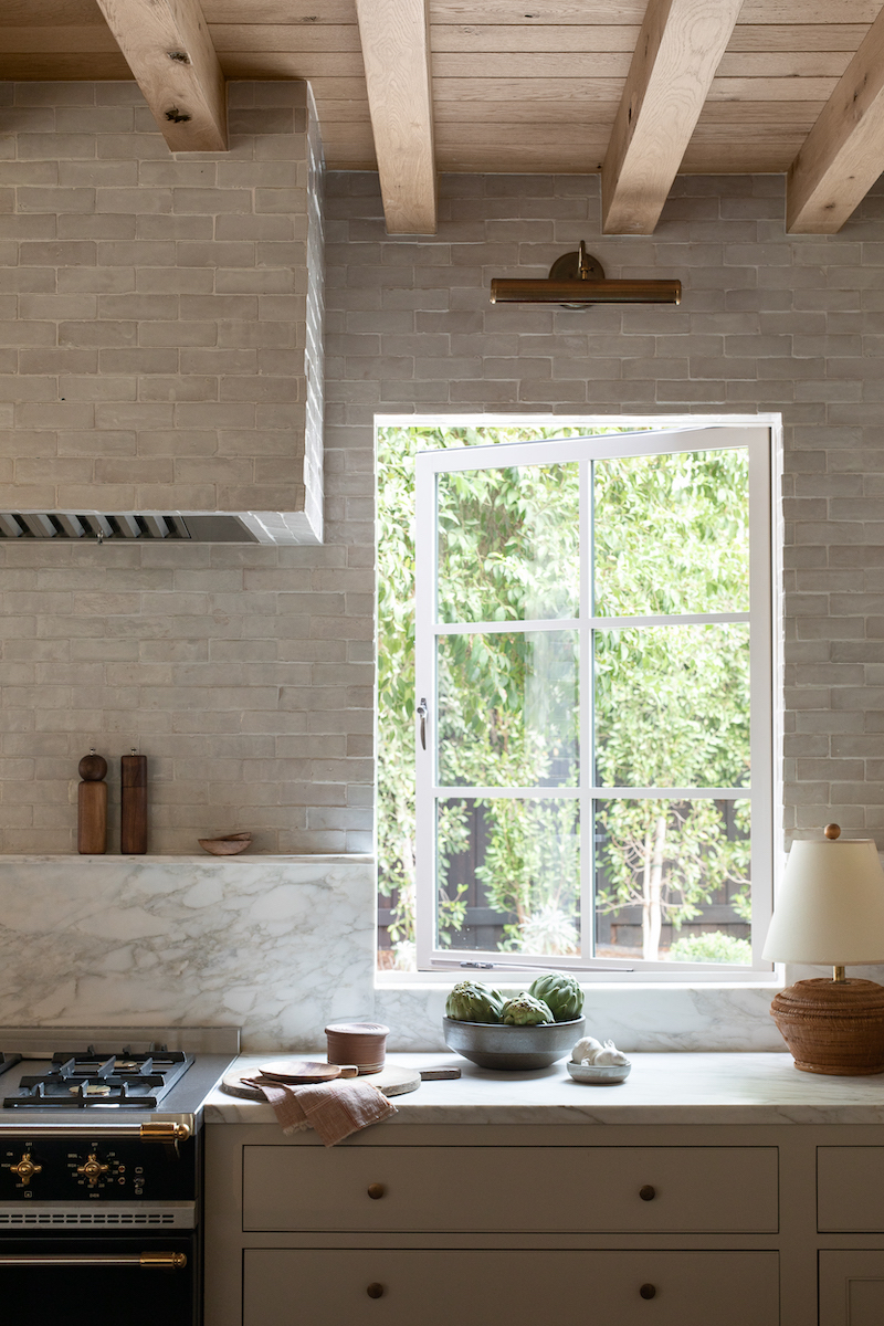 The kitchen in Amber Lewis’s farmhouse-style home, featuring Marvin Signature Ultimate Casement windows.