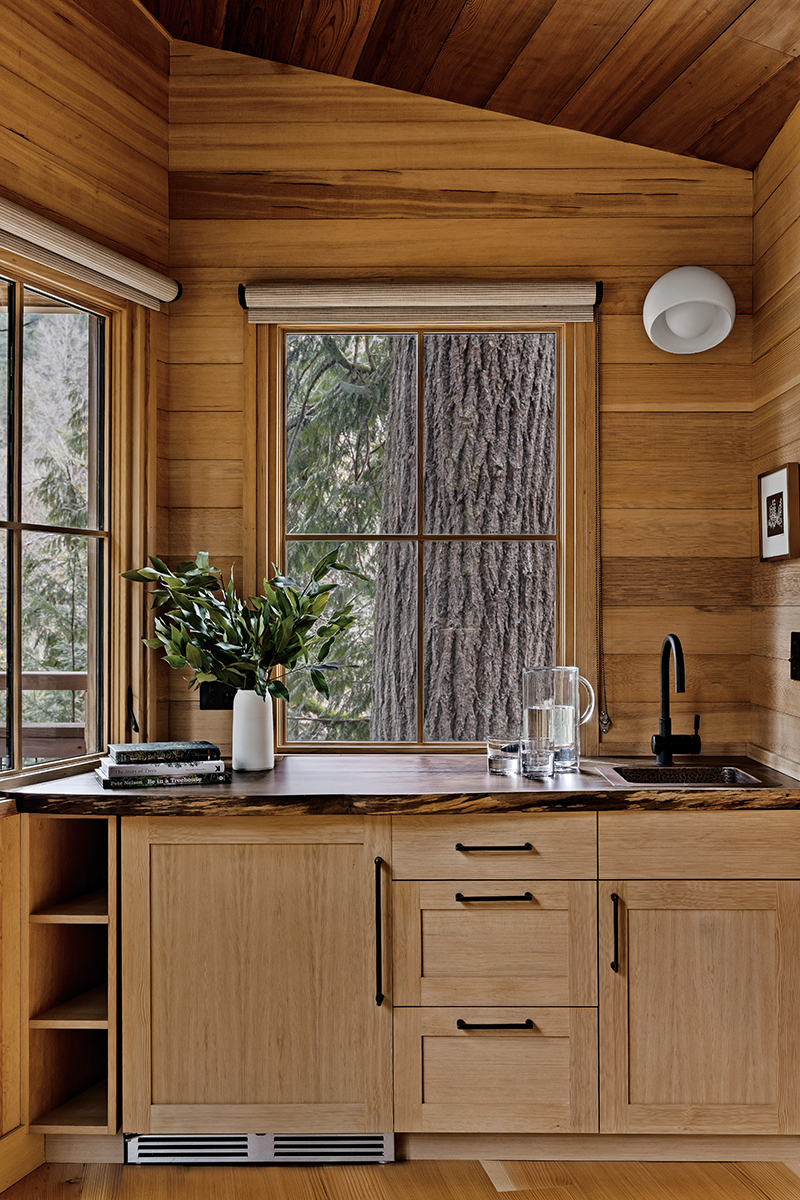 The kitchen inside Ananda Treehouse, an ADA accessible treehouse just outside of Seattle, featuring Marvin windows.