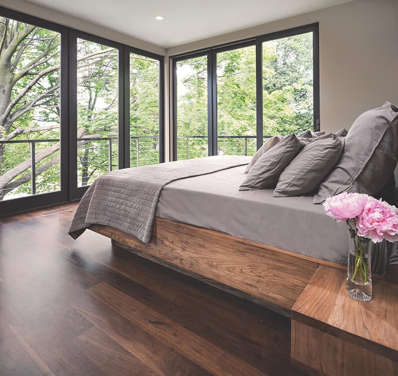 A minimalist bedroom featuring Marvin Elevate Sliding French Doors.