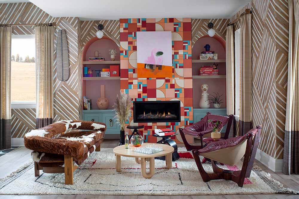 Bold colors bring life to this eclectic living room in the House Beautiful Whole Home, featuring Marvin windows.