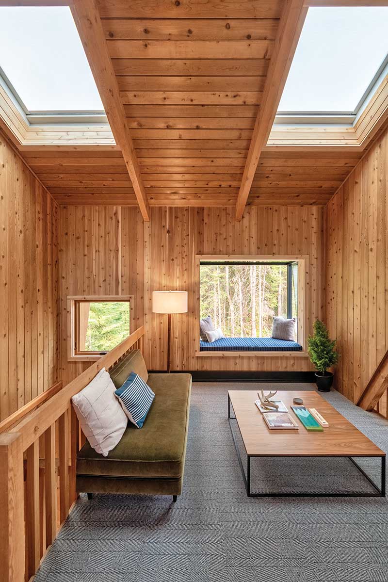 The loft of The Minne Stuga cabin, featuring Marvin Awaken Skylights and a Marvin Skycove.