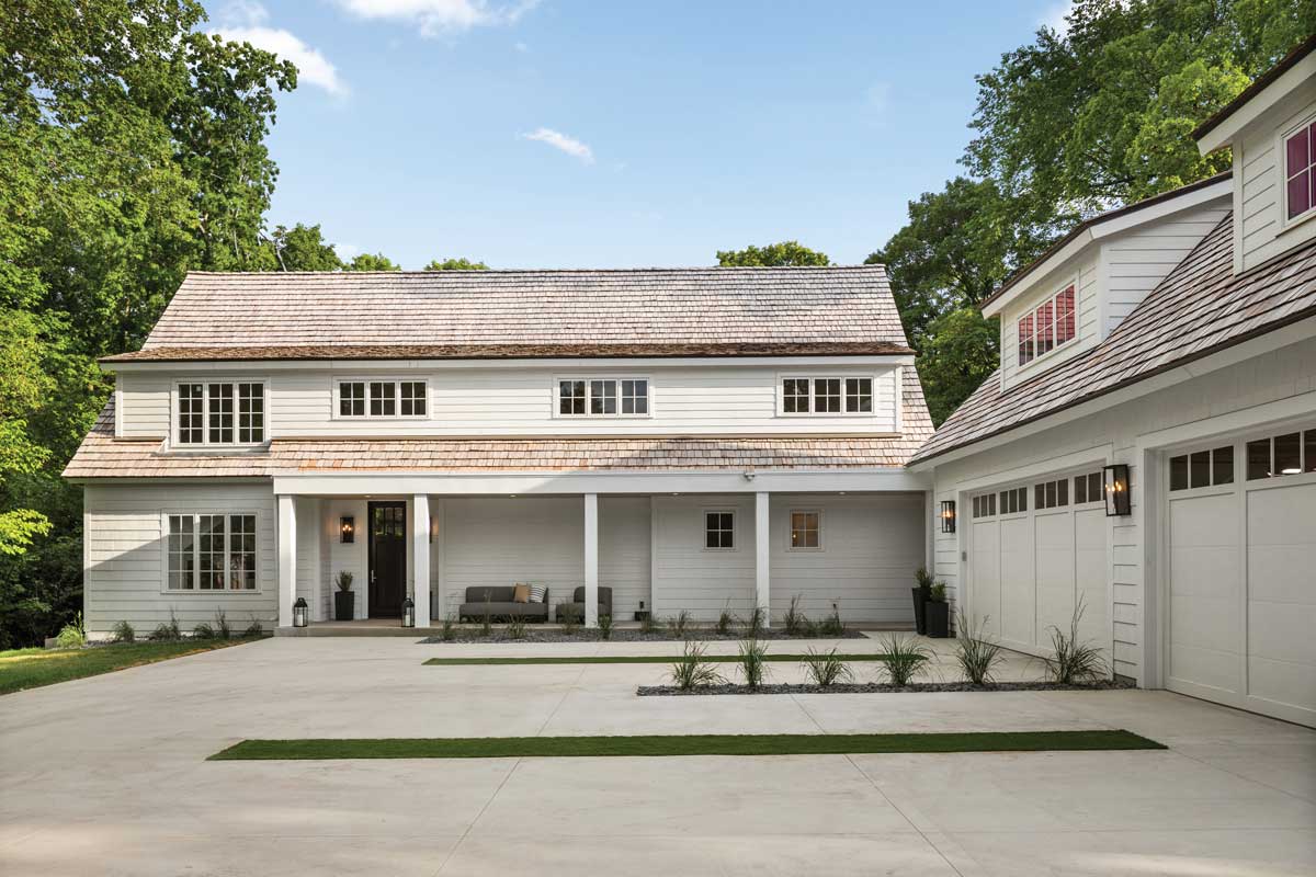 The exterior of a home and four-car garage featuring Marvin Elevate Casement and Double Hung windows.