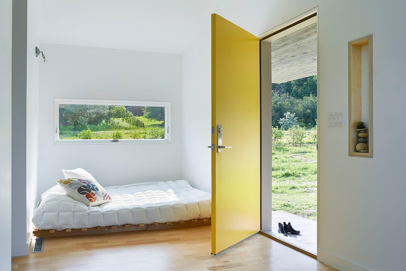 Home with Marvin Window and open Yellow door