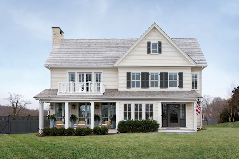 A traditional home overlooking Hingham Harbor, featuring Marvin windows and doors.
