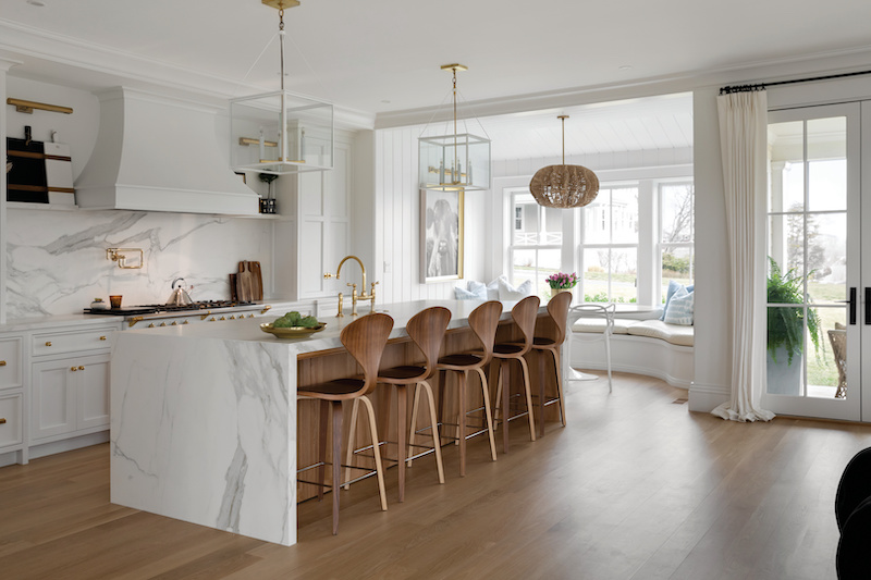 A bright, white kitchen featuring Marvin Elevate Double Hung windows and Elevate Inswing French doors.