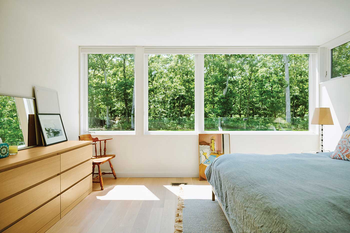 Bedroom in contemporary home featuring Ultimate Picture windows and Ultimate Casement window.