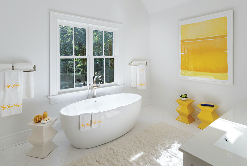 Bathroom with white Marvin windows and white interior design
