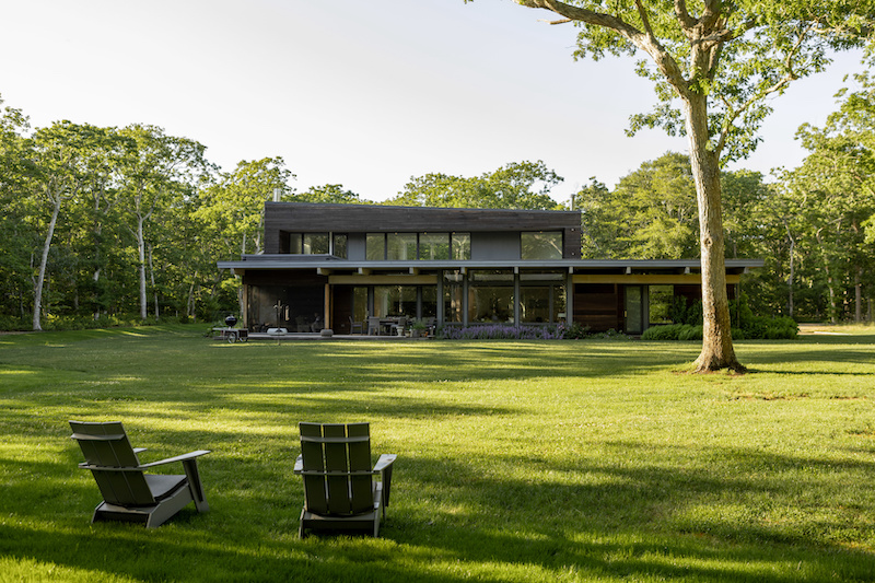 An exterior photo of a Turkel prefab home in Martha’s Vineyard featuring Marvin windows and doors.