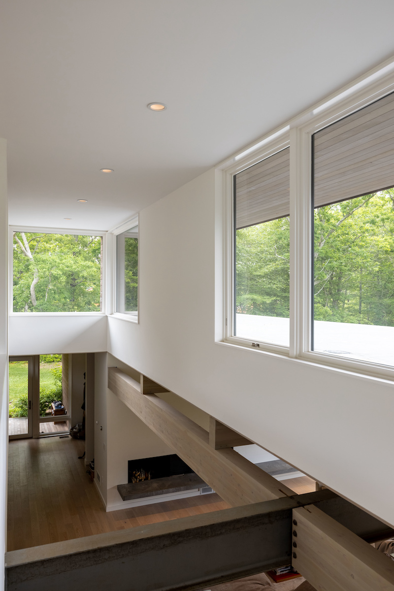 Marvin casement windows in double-height living areas of a prefab home in Martha’s Vineyard.