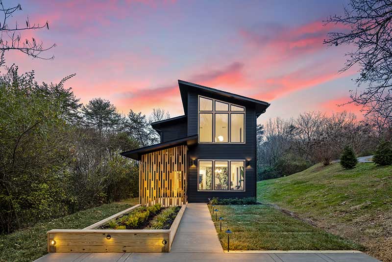 A home at sunset in Chatanooga, Tennessee, featuring Marvin Essential windows and doors.