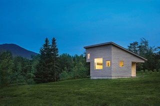 The exterior of a micro house in Vermont, featuring Marvin windows and doors.
