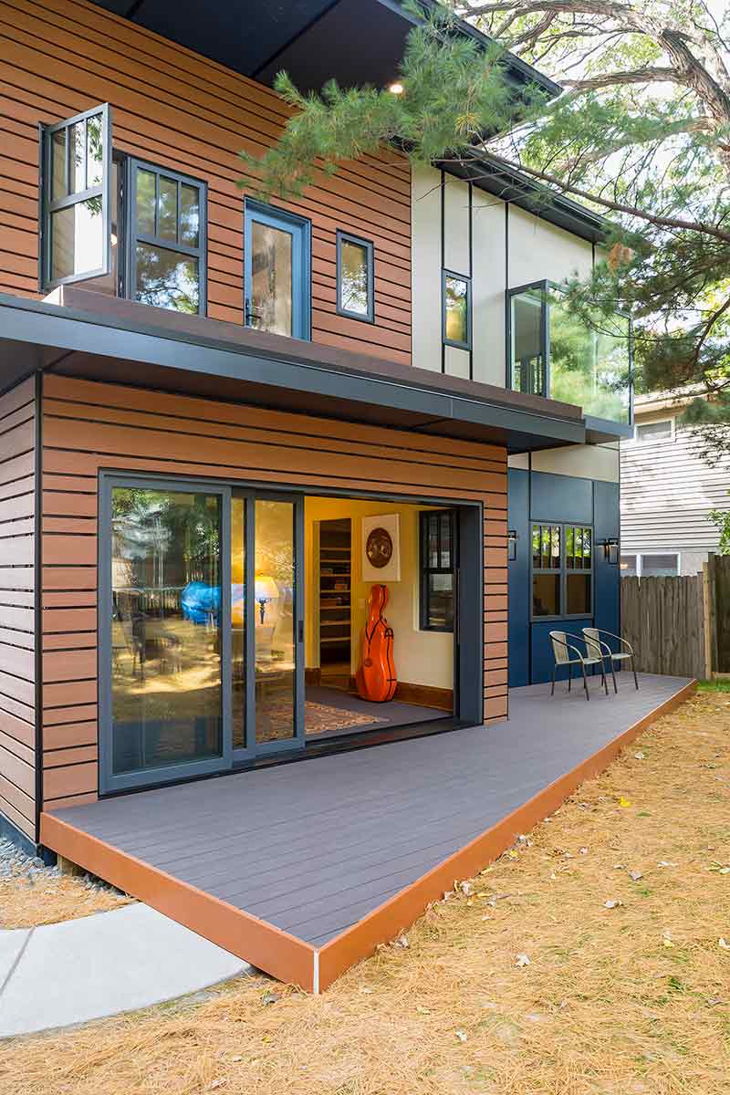 An exterior photo of back of Michael Anschel’s southwest Minneapolis home, featuring a Marvin Ultimate MultiSlide Door and Modern casement windows.
