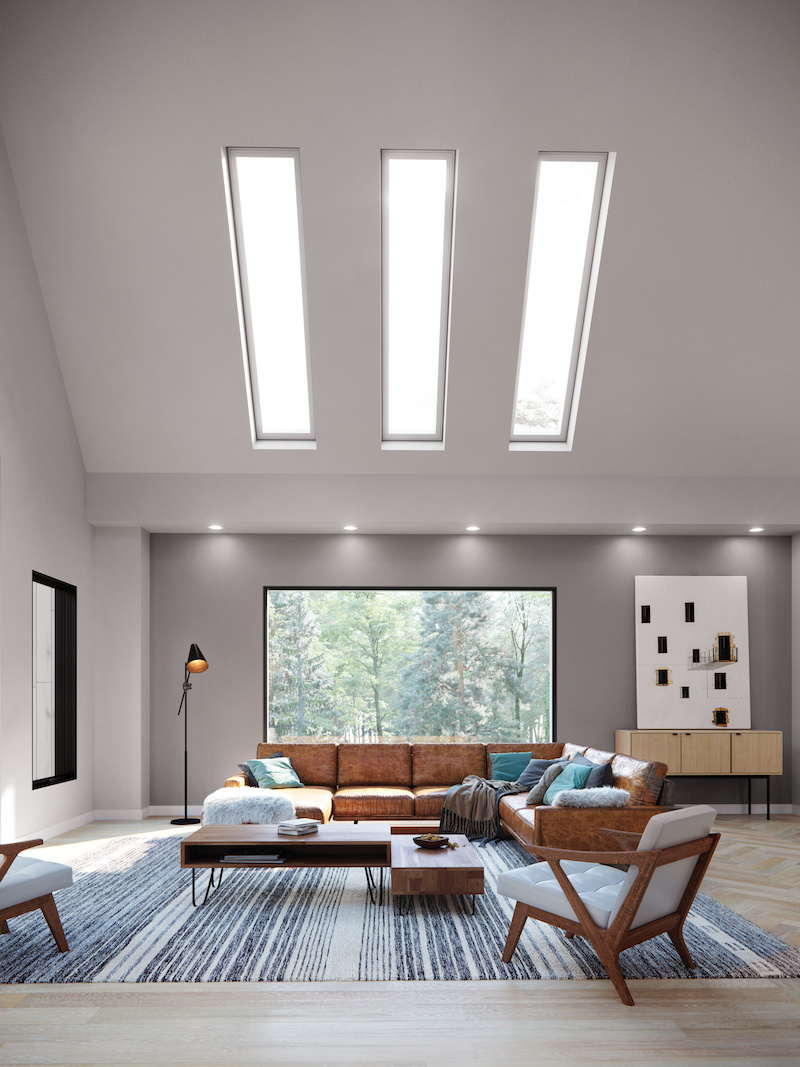 A modern living room featuring Marvin Skycove and three Marvin Awaken Skylights.