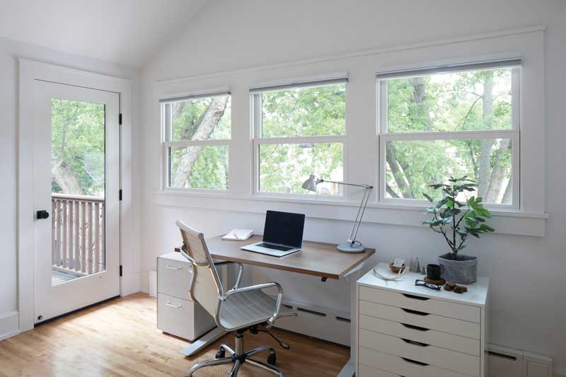 Marvin Elevate Inswing French Door and three Marvin Elevate Double Hung Windows in home office 