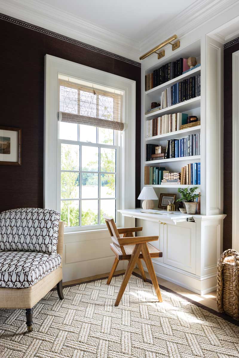 Marvin Ultimate Double Hung G2 Window next to a bookshelf that doubles as a desk