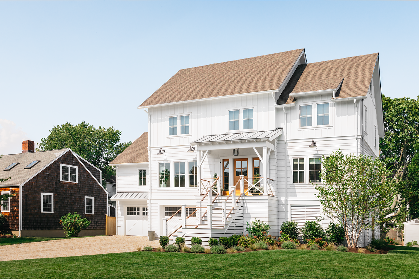 The exterior of Liz Joy’s remodeled home in Connecticut, featuring Marvin Elevate windows and doors.