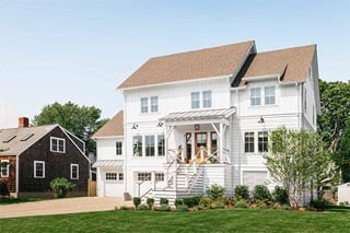 The exterior of Liz Joy’s remodeled home in Connecticut, featuring Marvin Elevate windows and doors.