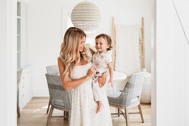 Liz Joy and her toddler in their remodeled Connecticut home, featuring Marvin Elevate windows and doors.