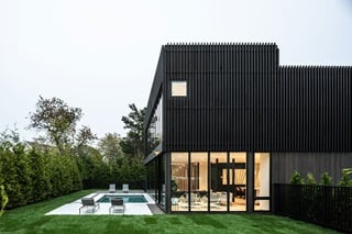 Exterior of a modern home in Sag Harbor, New York, designed by The UP Studio, featuring Marvin Modern windows and doors.