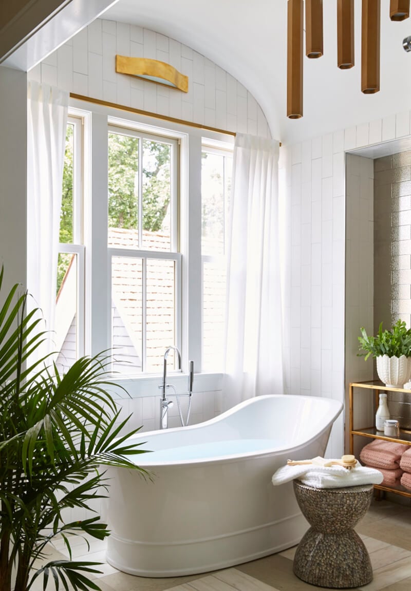 Modern style tub in front of Marvin Window