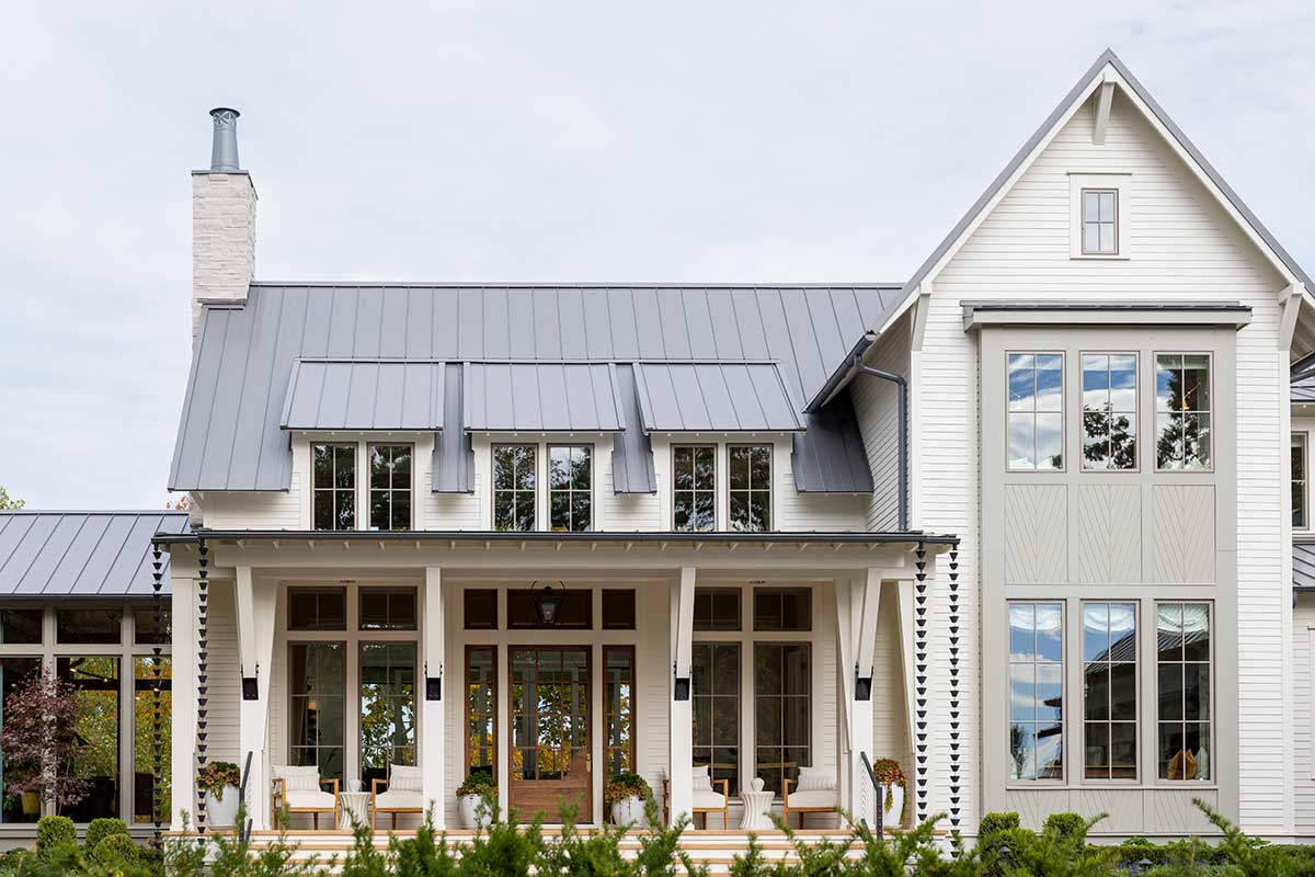 Exterior of home with Marvin Elevate Casement windows, inswing french door and direct glaze windows