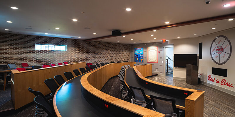 Interior office space conference room with stadium seating.