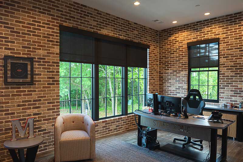 Vintage-styled office space with large Marvin casement windows.