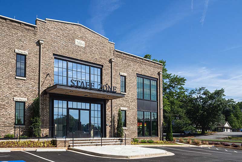 Exterior of renovated office building with expansive Marvin windows.