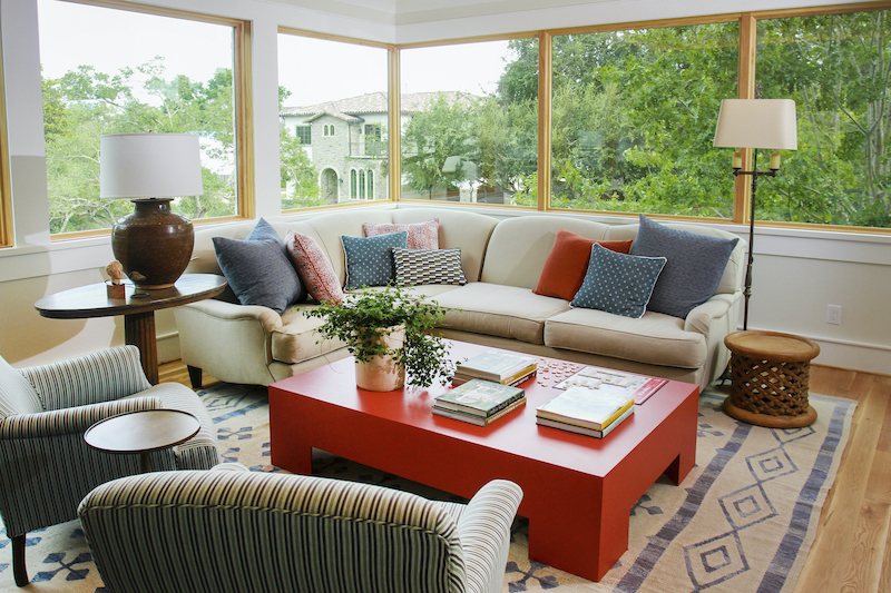 A second-floor sitting area featuring Marvin windows with expansive glass.