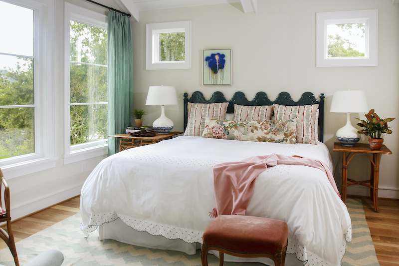 A bedroom in a Modern Farmhouse style home, featuring Marvin windows.