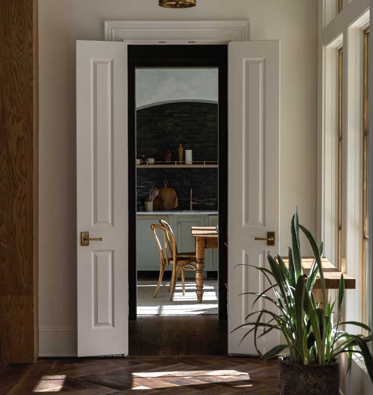 An open door into the butler's pantry of the Southern Living Idea House 2023 in Leiper's Fork, TN.