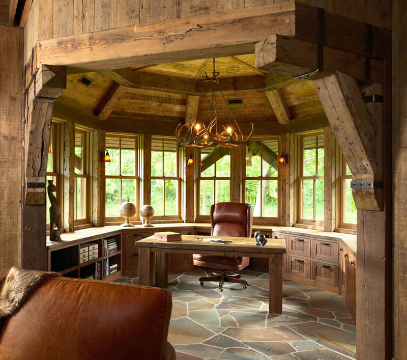 Home office with wood beams and chandelier and multiple Marvin Windows