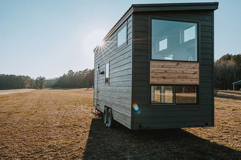 The exterior of a tiny home with Marvin windows, made by Wind River Tiny Homes.