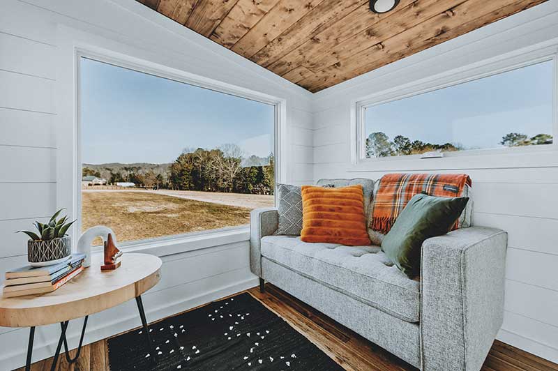 The interior of a tiny home with Marvin windows, made by Wind River Tiny Homes.