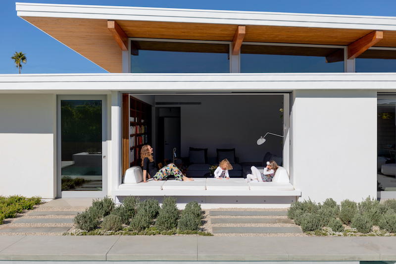 The living platform, or window seat, at the Axiom Desert House featuring Marvin windows and doors.